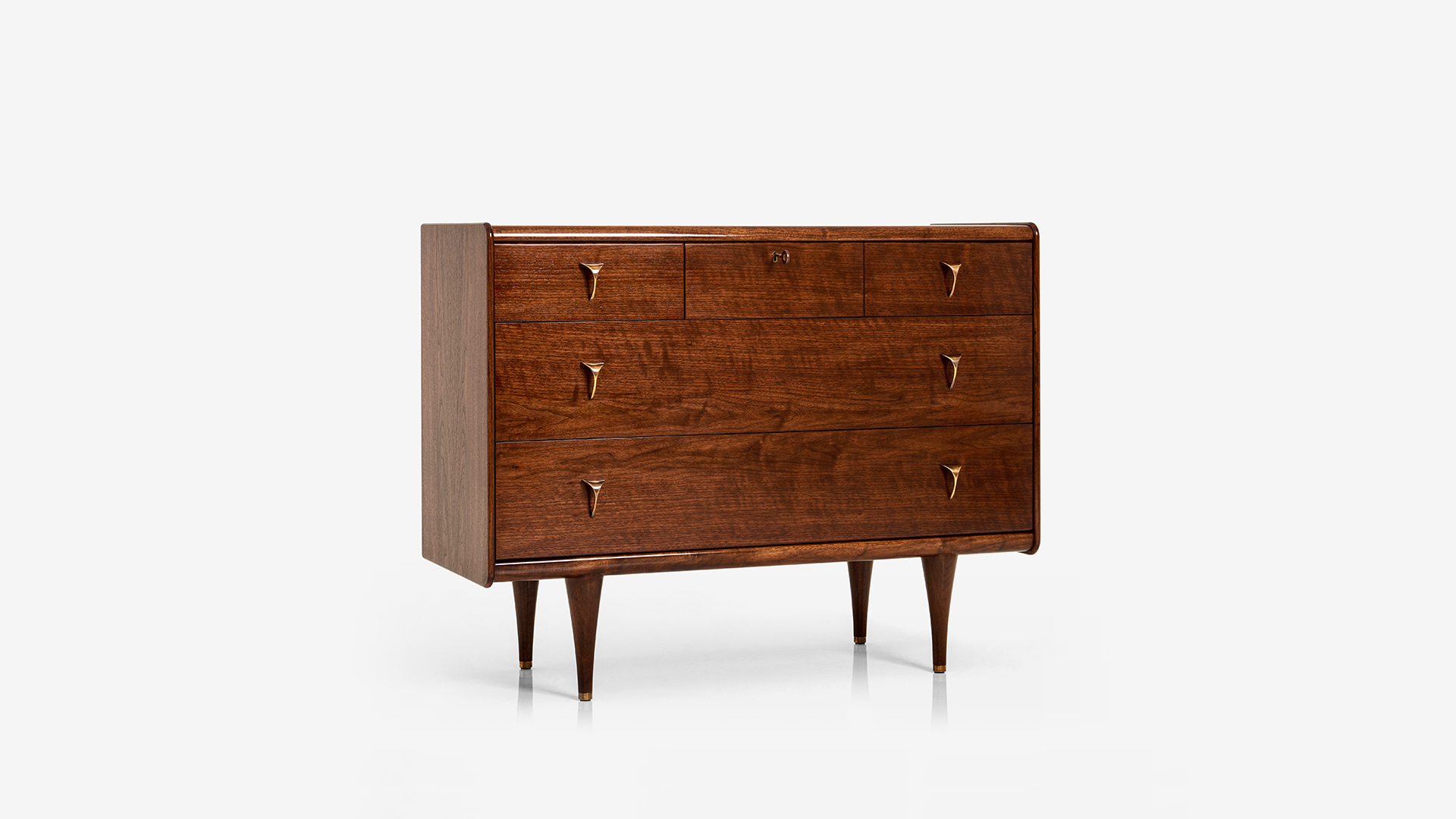 Adler Chest of Drawers in Walnut Dark French polish with Antique brass handles and recessed glass top