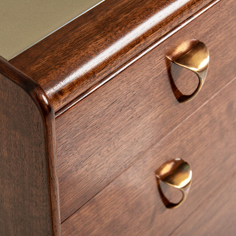 Adler Chest of Drawers in Walnut Dark French polish with Antique brass handles and recessed glass top